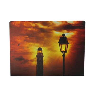 Northlight LED Lighted Lighthouse And Lantern Lamp Post With Amber Sky Canvas Wall Art 15.75" X 11.75"